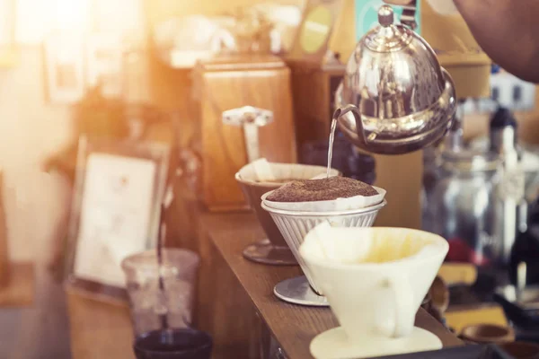 Hand drip coffee. Hot coffee ground with filter in cafe.