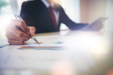 Business people working with document chart paper checking information inside.