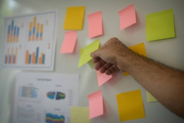 Close-up hand present business graph chart on whiteboard. planning concept.