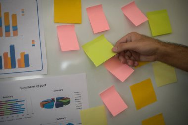 Close-up hand present business graph chart on whiteboard. planning concept.