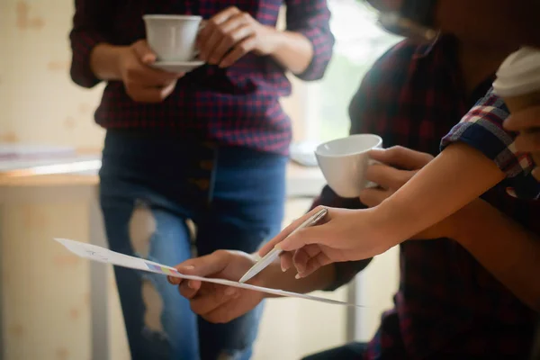 stock image Startup business people group meeting. People group sitting on conference together and making notes. hands pointing at business document during discussion at meeting.