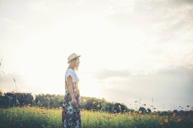 Young woman walking in a park, Relax concept