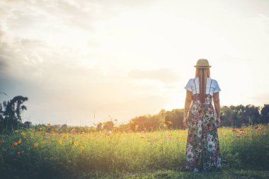 Young woman walking in a park, Relax concept