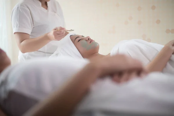 Beautiful woman lying on spa mask face with treatment spa, relax and healthy