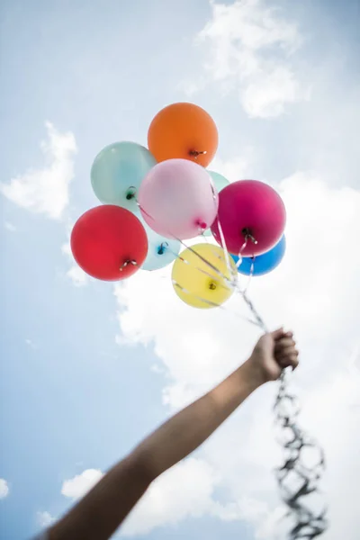 Young Girl Hand Holding Colorful Balloons — Stock Photo, Image