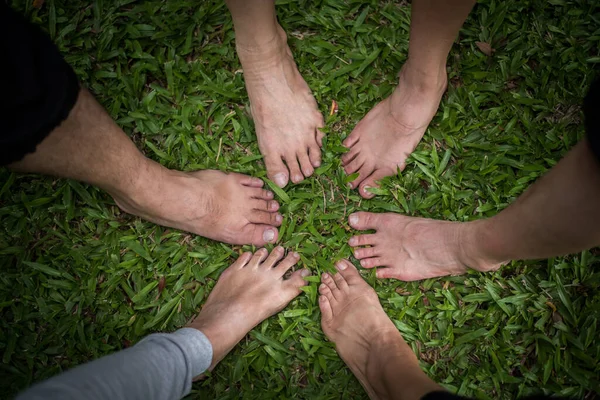 Group of friends with bare feet together.