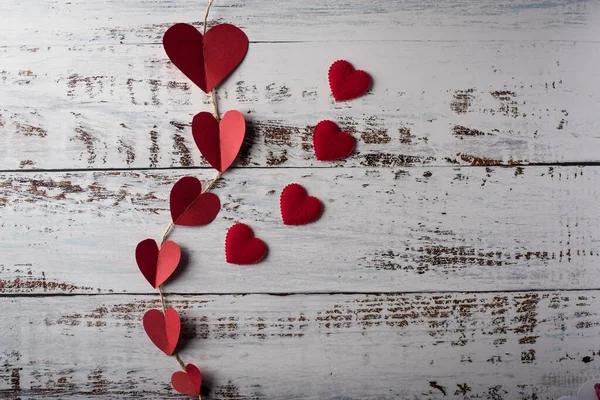 Top view Red heart in line on wood background