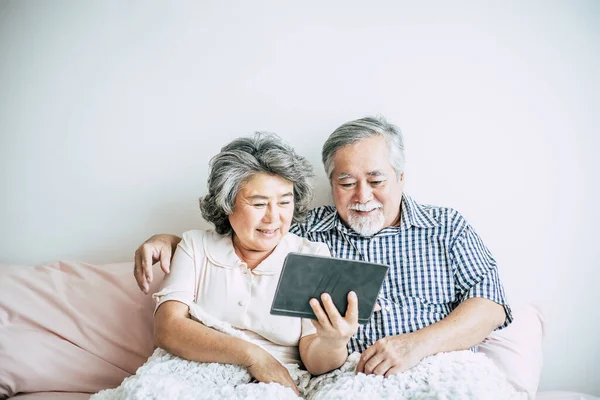 Elderly Couple Using tablet computer