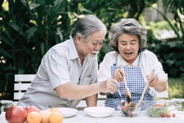 Elderly couples Cooking Healthy food together