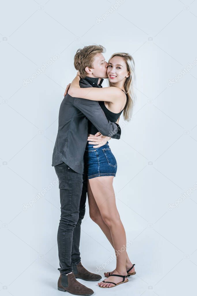 Portrait of happy young couple love together in studio