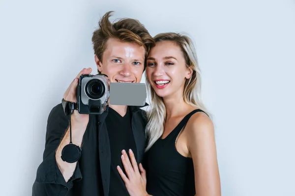 Happy portrait of Couple holding Video camera and Record clip video