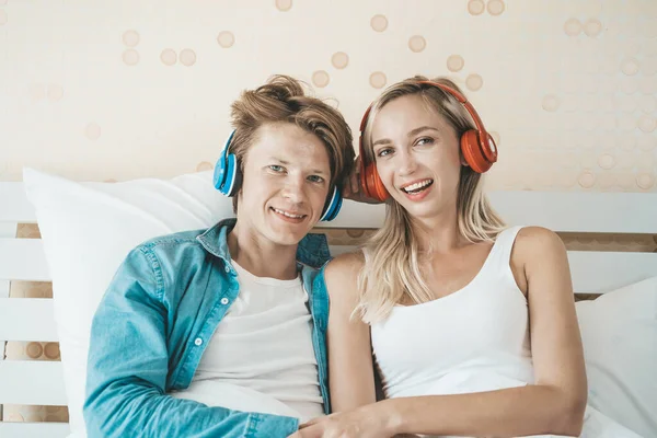 stock image Happy couple listening song in the morning at bedroom