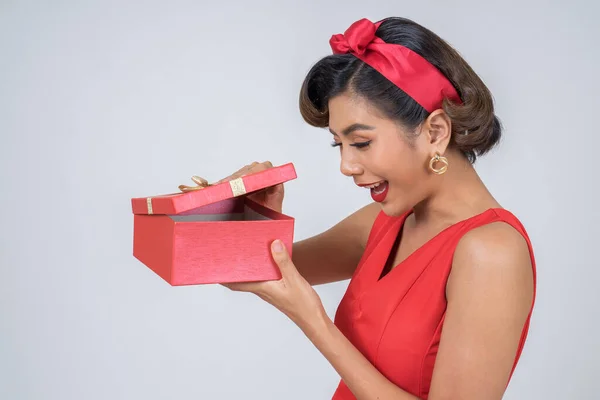 Beautiful happy woman with surprise gift box