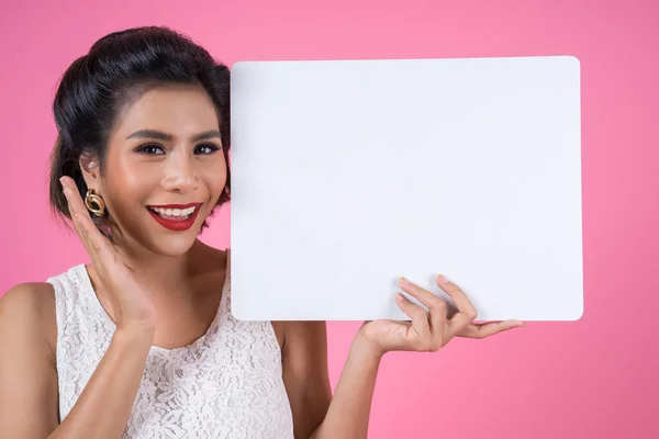 Portrait Fashion Woman Displaying White Banner Royalty Free Stock Photos