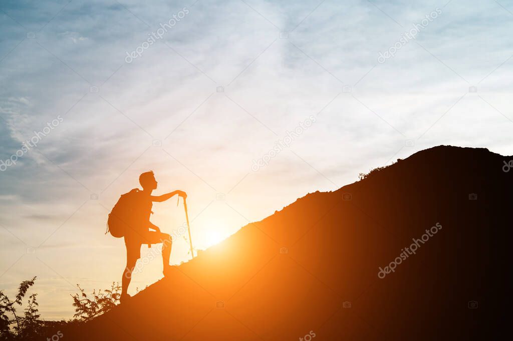 One man walked up the hill with his cane.