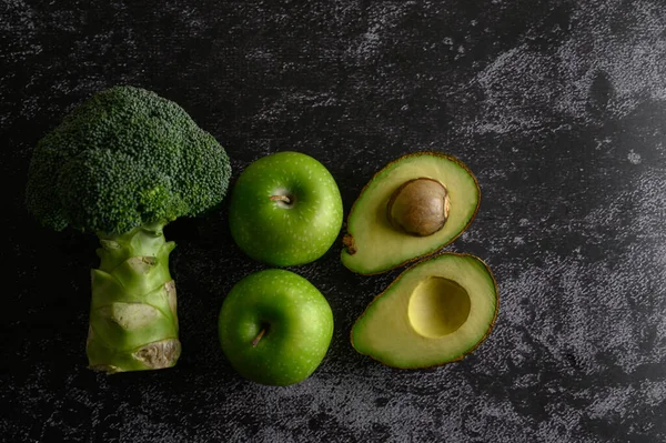 Broccoli Apple Avocado Black Cement Floor Background Selective Focus — Stock Photo, Image