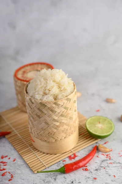 Thai Sticky Rice Woven Bamboo Basket Wooden Panel Chilies Lime — Stock Photo, Image