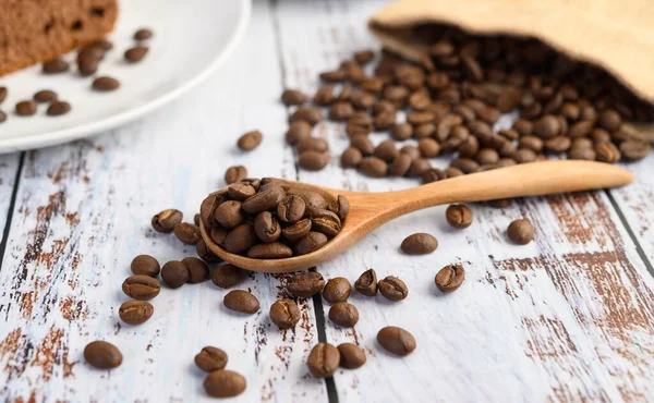 Coffee Beans Wooden Spoon Hemp Sacks White Wood Table — Stock Photo, Image