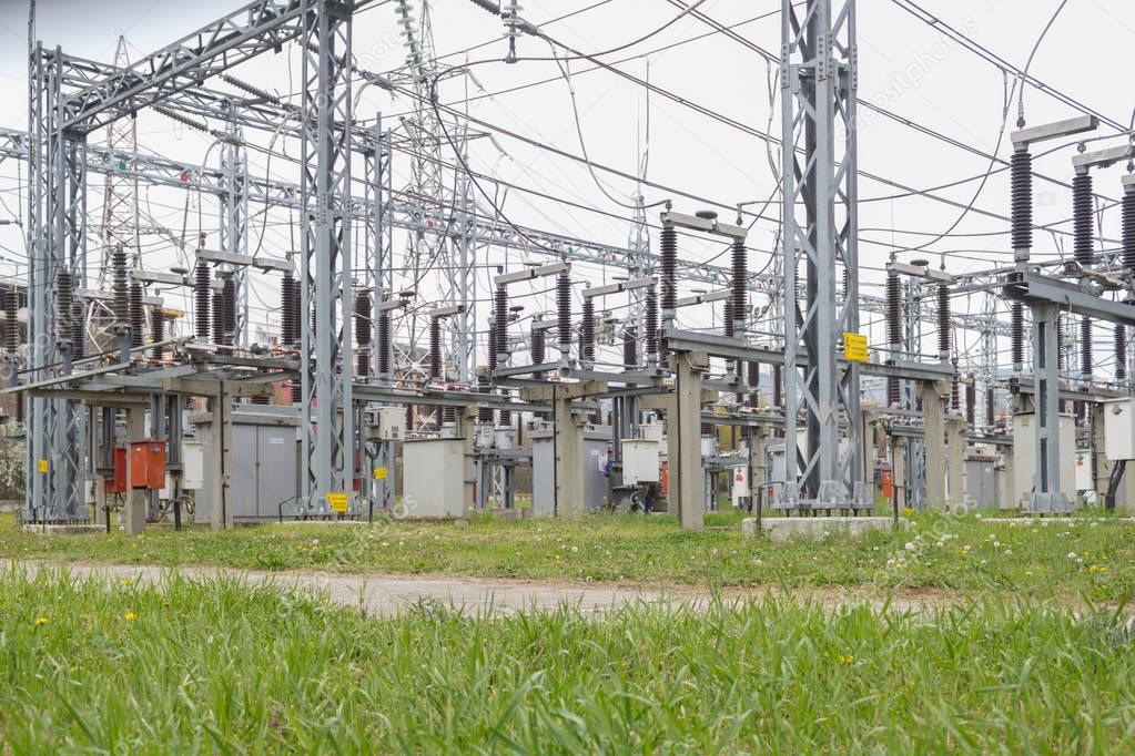 Electrical distribution station, transformers, high-voltage lines, electricity.