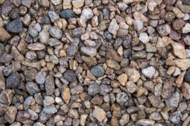 Küçük taşlar, çakıl dokusu. Gri renkler.