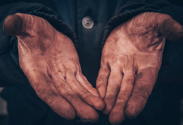 dirty hands of a man, a working man, a man drained his hands whi