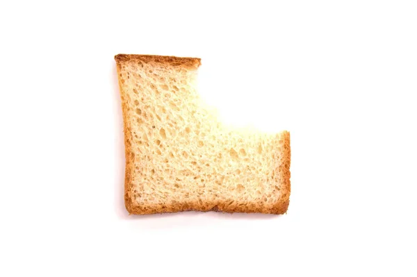 En bit vit toast brödbiten på vit bakgrund — Stockfoto