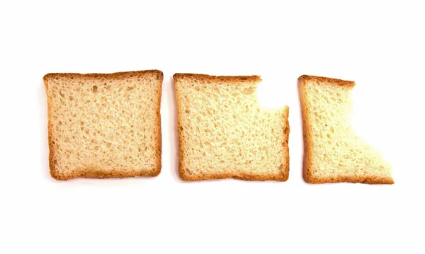 Beyaz arka plan üzerinde tost ekmeği üç ısırık — Stok fotoğraf