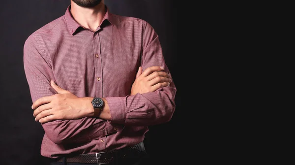 A successful businessman man on a black background of the city.