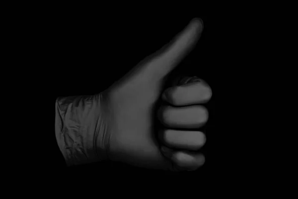 Black glove on black background — Stock Photo, Image