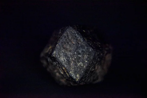 garnet stone in rough form with metal ore