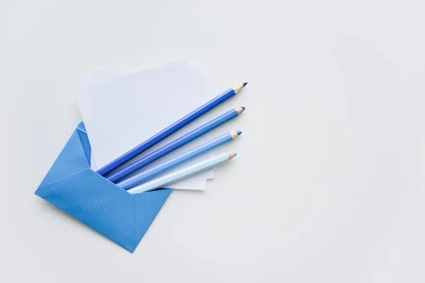 Fselective Focus Our Blue Pencils White Papers Out Blue Envelope — Stock Photo, Image