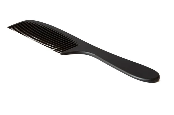 Black hairbrush on a white background — Stock Photo, Image