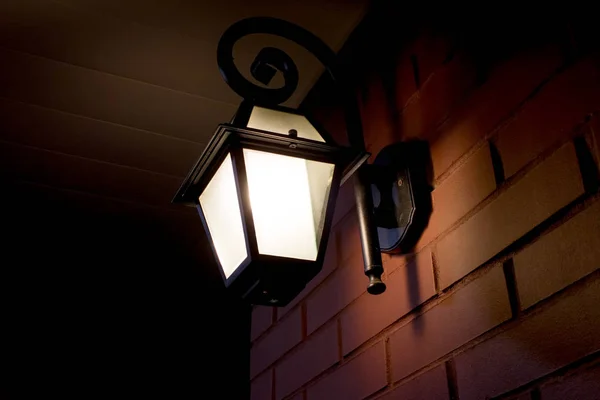 Lantern on a brick wall — Stock Photo, Image