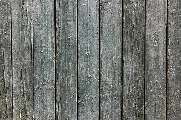 墙体质感由旧的灰色木板制成 带有开裂的剥皮涂料 灰色垂直旧彩绘板的背景 — 图库照片