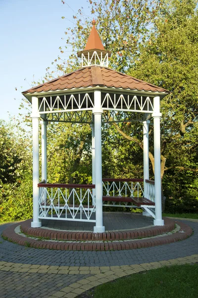 Garden furniture for relaxing in the park. Summer park, green leaf