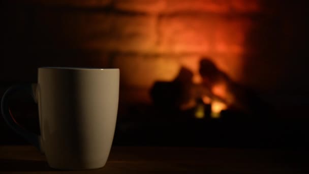 Cup Coffee Stands Old Wooden Board Front Burning Fireplace — Stock Video