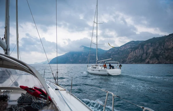 Sailing boat on a sea and deep cloudy background ,landscape italian