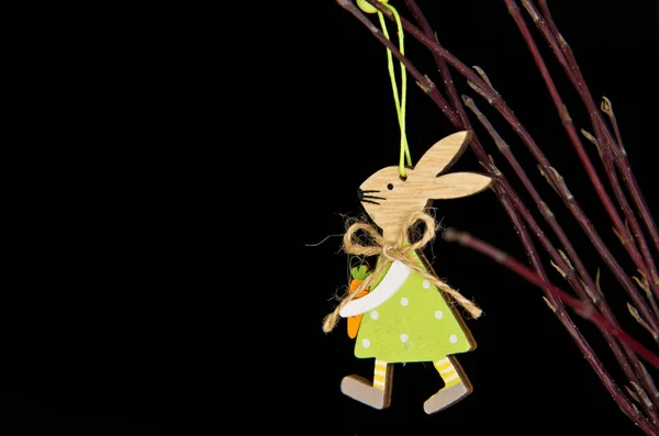Wooden Easter bunny hanging on twigs — 图库照片
