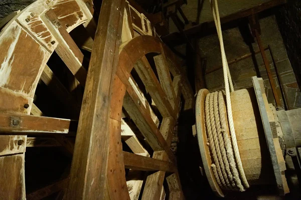 stock image old salt mine technology wooden wheel machine