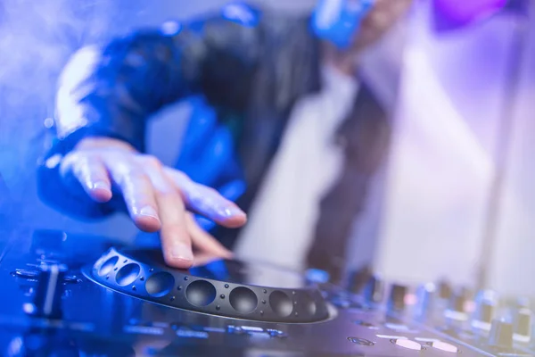 Dj mixing at party festival with blue light and smoke — Stock Photo, Image