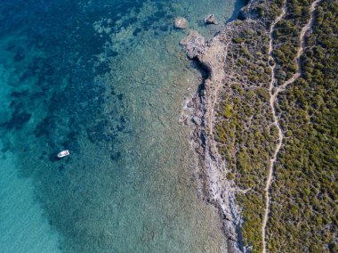 Aerial view of the path of customs officers, vegetation and Mediterranean bush, Corsica, France. Sea and vegetation seen from above, rocks and rocks. Sentier du Douanier. Capo Corso clipart