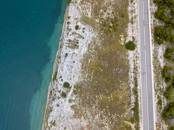 Aerial view of a road overlooking the sea, road that runs along the sea. Coast line.