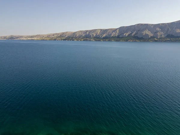 Aerial view of the coast of Croatia, headlands overlooking the sea, island of Pag. Overview of mountains and sea on the coasts of Croatia. Wild and uncontaminated nature. Transparent sea