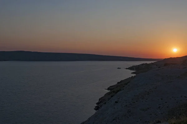 Croatia, 30/06/2018: panoramic view at sunset from the road on the island of Pag, the fifth-largest island of the Croatian coast in the northern Adriatic Sea and the one with the longest coastline