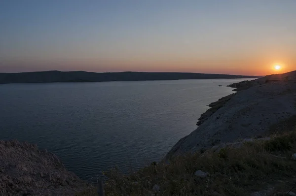 Croatia, 30/06/2018: panoramic view at sunset from the road on the island of Pag, the fifth-largest island of the Croatian coast in the northern Adriatic Sea and the one with the longest coastline