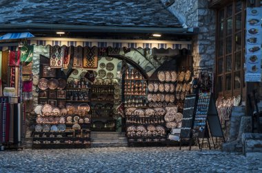 Bosnia Herzegovina, Europe, 5/07/2018: the night skyline of the Old Bazaar Kujundziluk, the muslim quarter of the old town of Mostar with its local craft products shops clipart