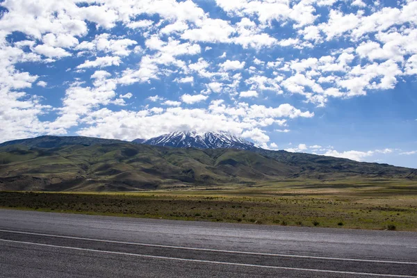 Turkey, Middle East: the road from Igdir to Dogubayazit with view of Mount Ararat, Agri Dagi, the highest mountain in the extreme east of Turkey, the resting place of Noah\'s Ark for Christianity, snow-capped and dormant compound volcano