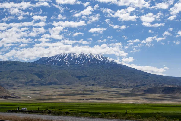 Turkey, Middle East: the road from Igdir to Dogubayazit with view of Mount Ararat, Agri Dagi, the highest mountain in the extreme east of Turkey, the resting place of Noah\'s Ark for Christianity, snow-capped and dormant compound volcano