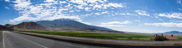 Turkey, Middle East: the road from Igdir to Dogubayazit with view of Mount Ararat, Agri Dagi, the highest mountain in the extreme east of Turkey, the resting place of Noah's Ark for Christianity, snow-capped and dormant compound volcano