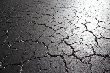 Eski yol arka plan - gri yüzeyi asfalt doku yakın kadar Miami şehir sokak kırık. siyah kırık asfalt. taş arka plan